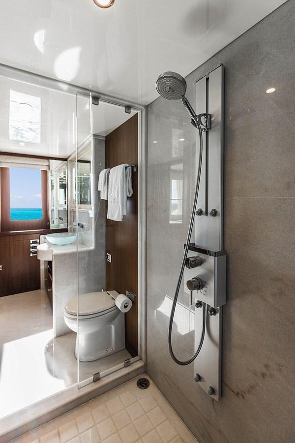 a bathroom with a shower unit and toilet aboard SEE WORTHY Yacht for Sale