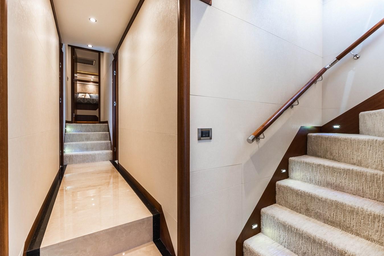 a hallway with a staircase and a staircase aboard SEE WORTHY Yacht for Sale
