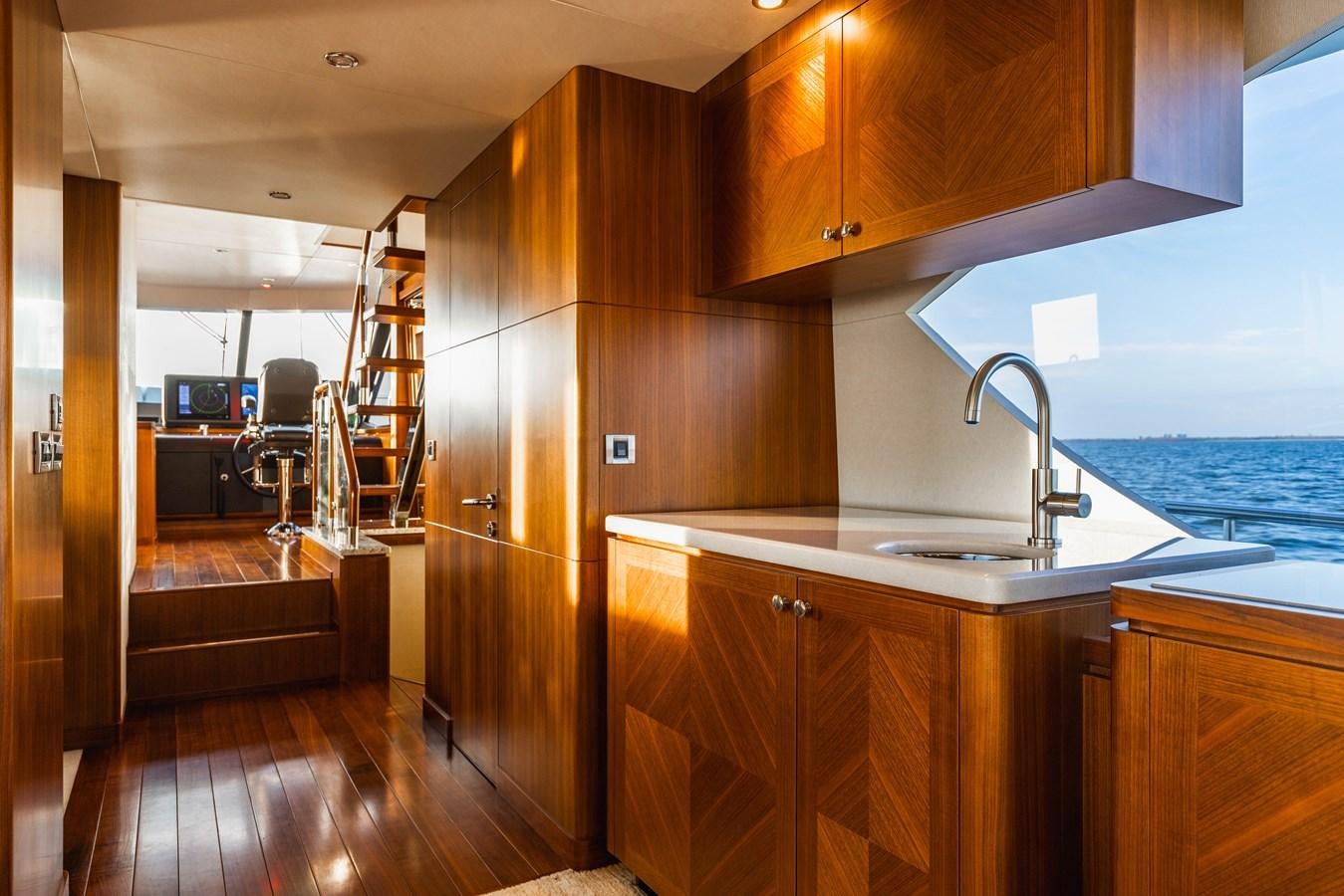 a kitchen with a sink and a ladder aboard SEE WORTHY Yacht for Sale