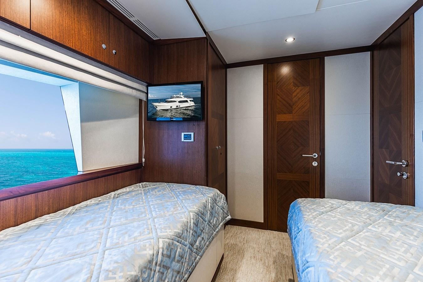 a room with a bed and a television aboard SEE WORTHY Yacht for Sale