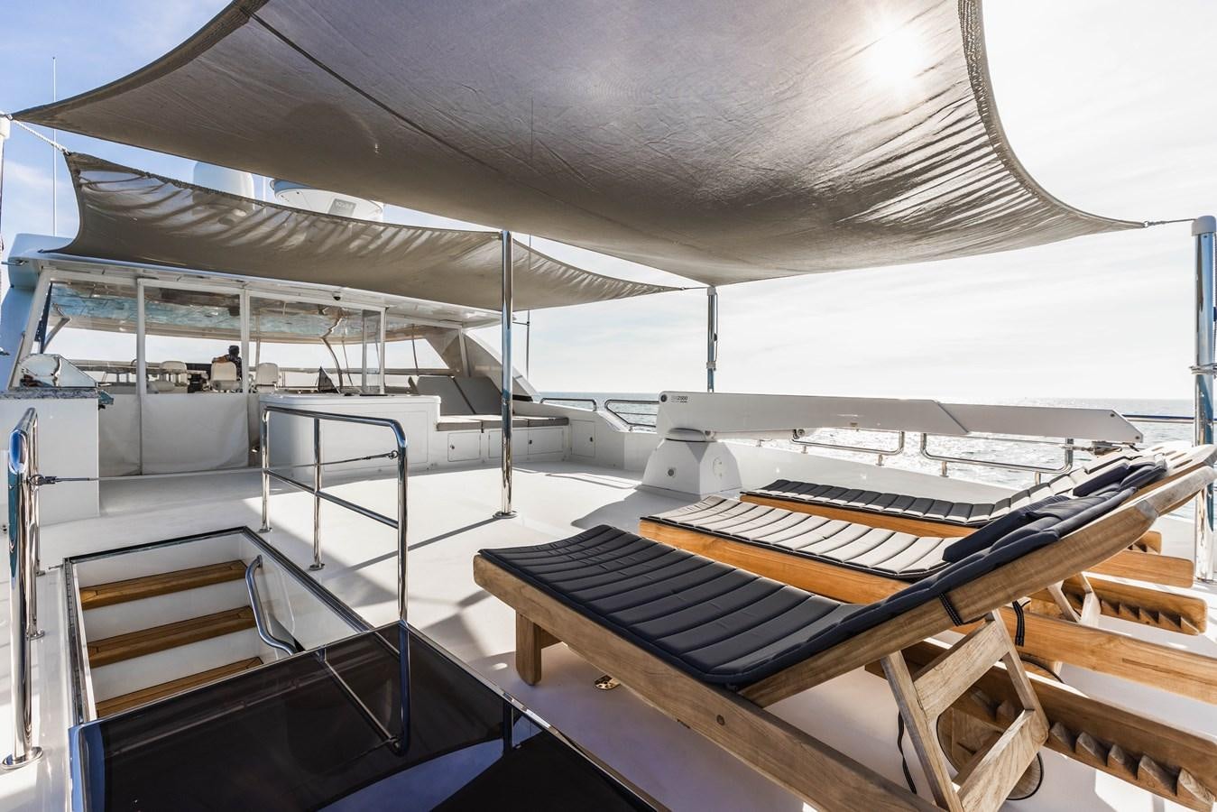 a large room with a large white tent and a table with chairs aboard SEE WORTHY Yacht for Sale