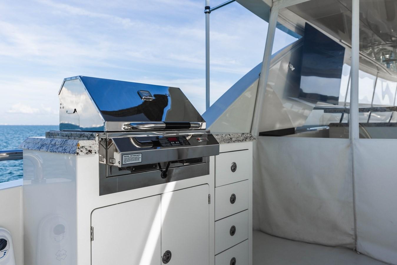 a boat with a blue cover aboard SEE WORTHY Yacht for Sale