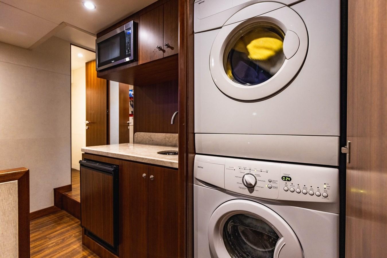 a washing machine in a kitchen aboard SEE WORTHY Yacht for Sale