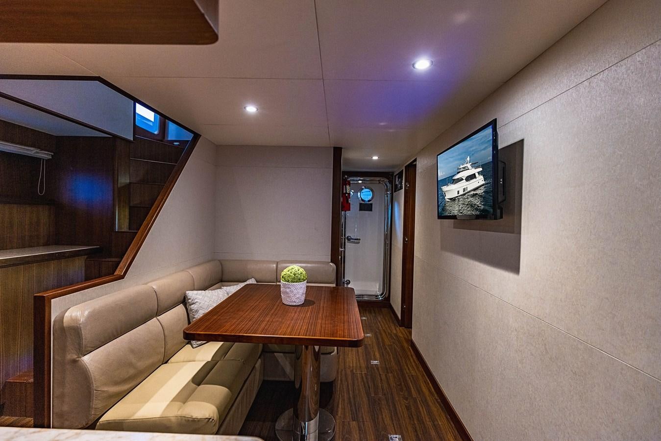 a living room with a table and couches aboard SEE WORTHY Yacht for Sale