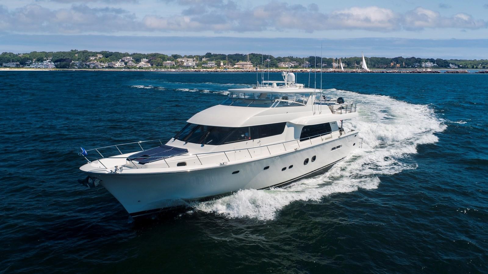 a white yacht on the water aboard TRANQUILITY Yacht for Sale
