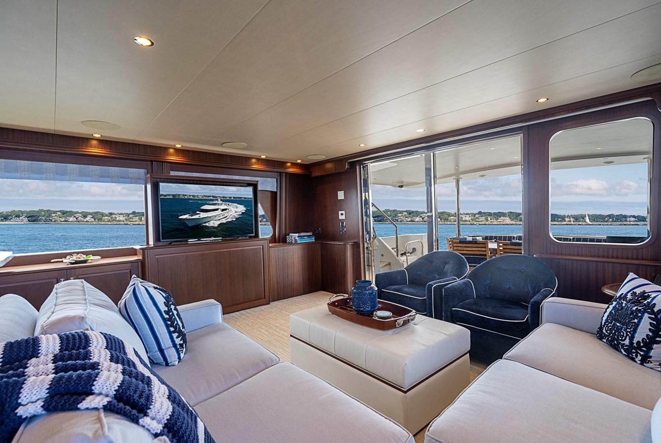 a living room with a large window aboard TRANQUILITY Yacht for Sale