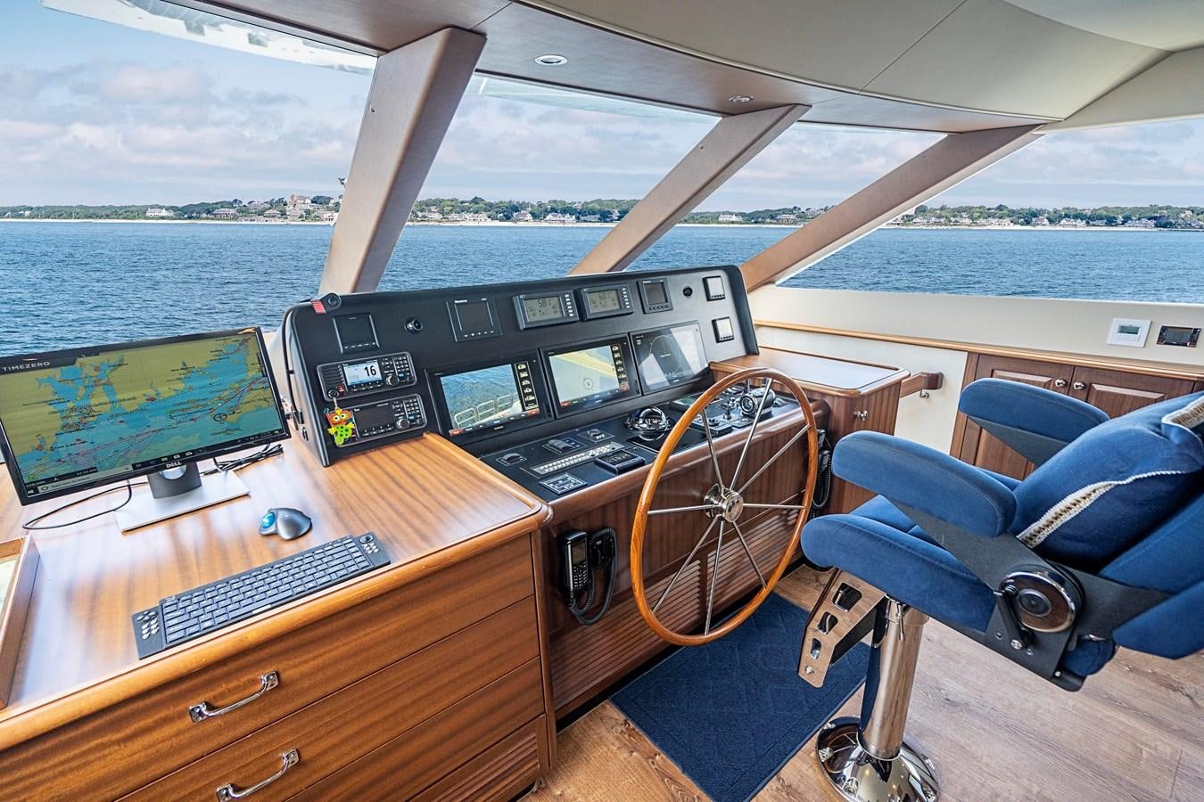 a wooden desk with a laptop on it aboard TRANQUILITY Yacht for Sale