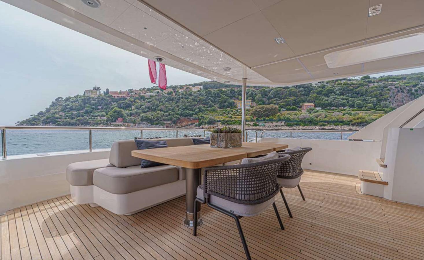 a table and chairs on a deck aboard PRINCESS 35M AVALON Yacht for Sale