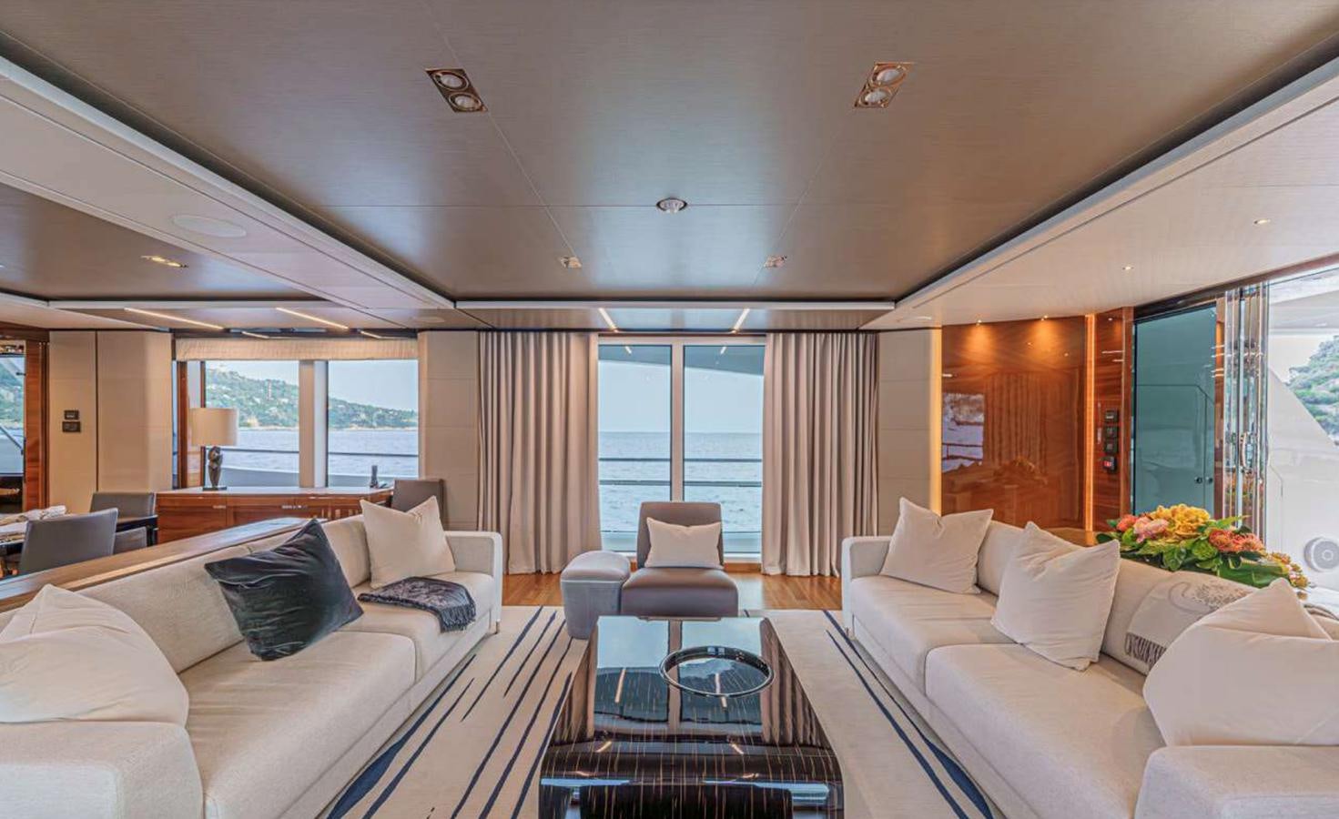 a living room with a large window aboard PRINCESS 35M AVALON Yacht for Sale
