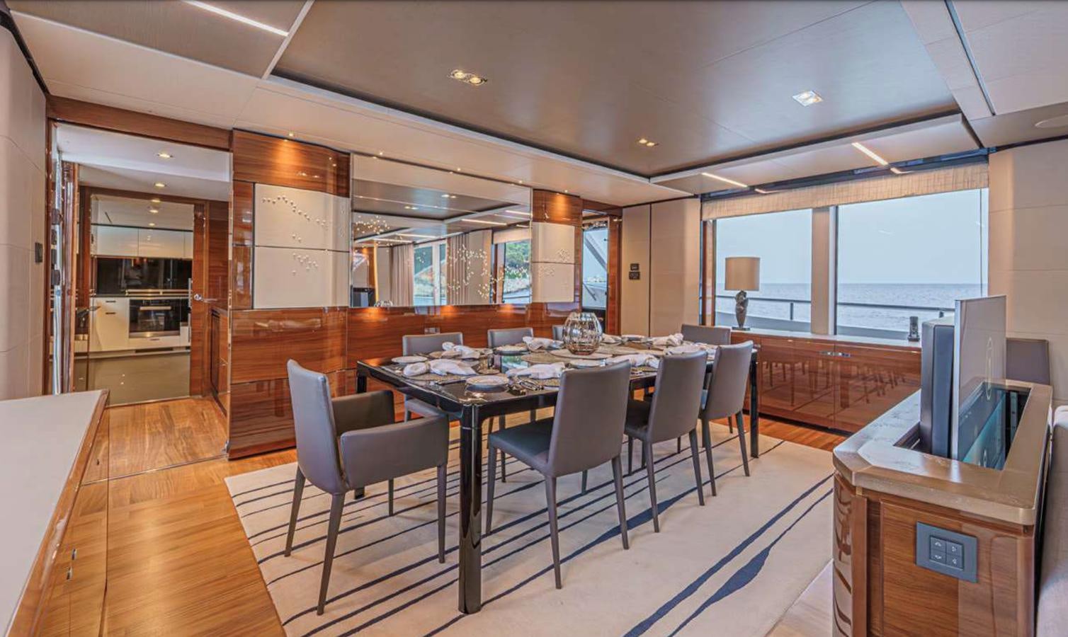 a large room with a table and chairs aboard PRINCESS 35M AVALON Yacht for Sale