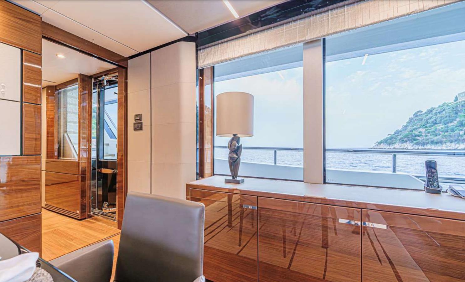a room with a large window and a view of the water aboard PRINCESS 35M AVALON Yacht for Sale