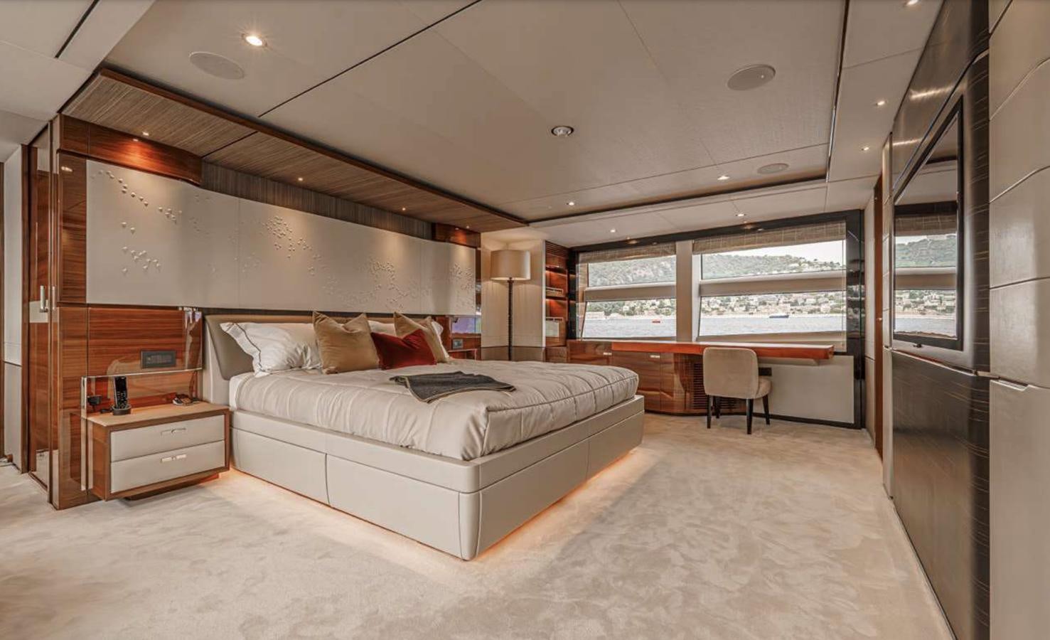 a large bedroom with a bed aboard PRINCESS 35M AVALON Yacht for Sale
