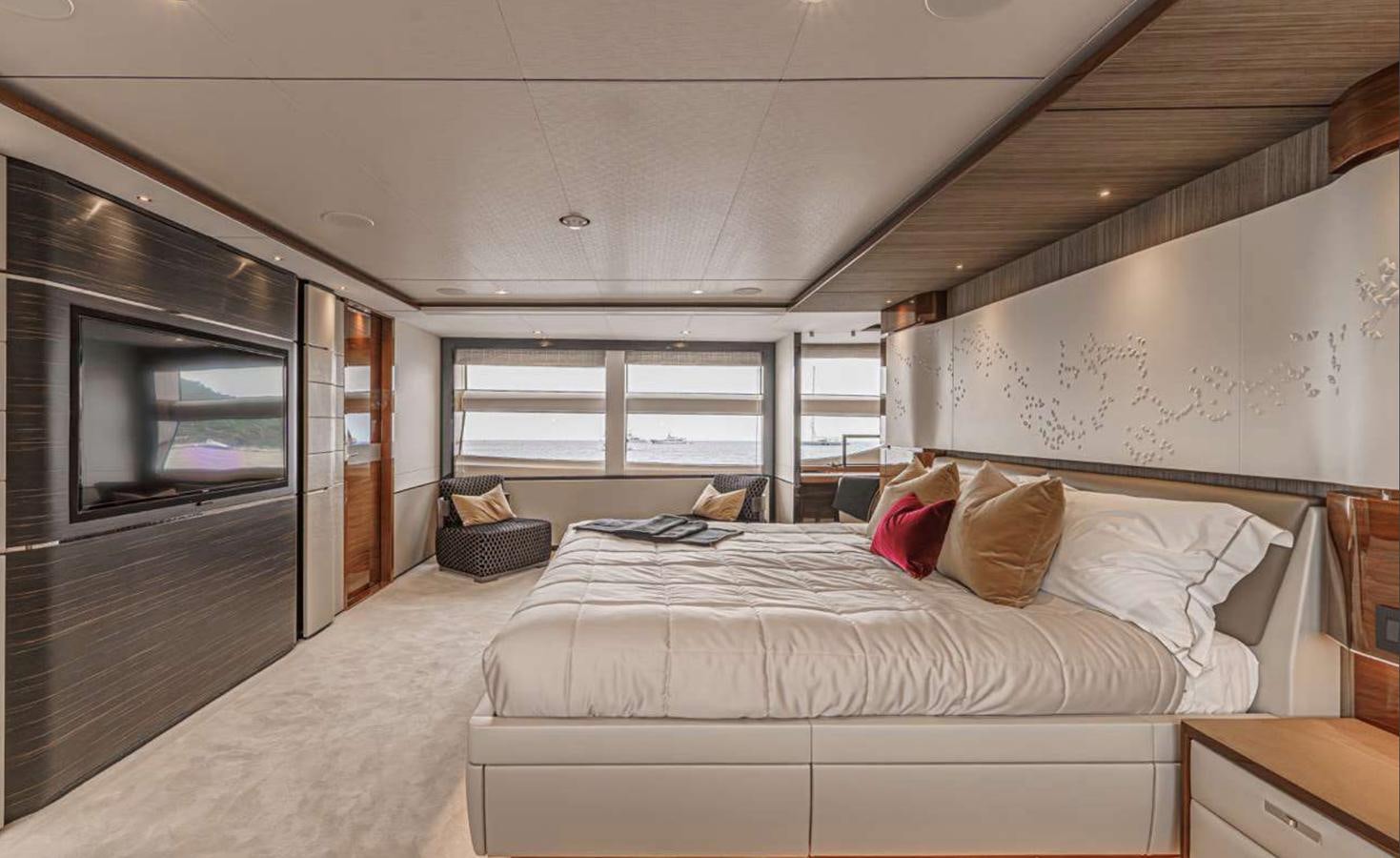 a bedroom with a bed and a tv aboard PRINCESS 35M AVALON Yacht for Sale
