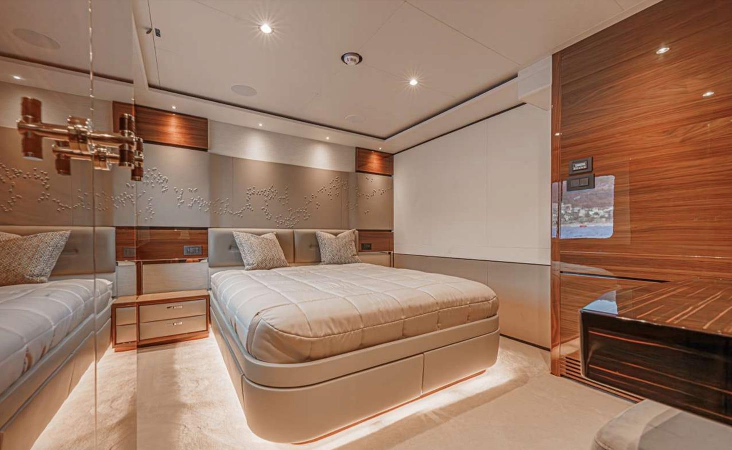 a bedroom with a bed and a couch aboard PRINCESS 35M AVALON Yacht for Sale