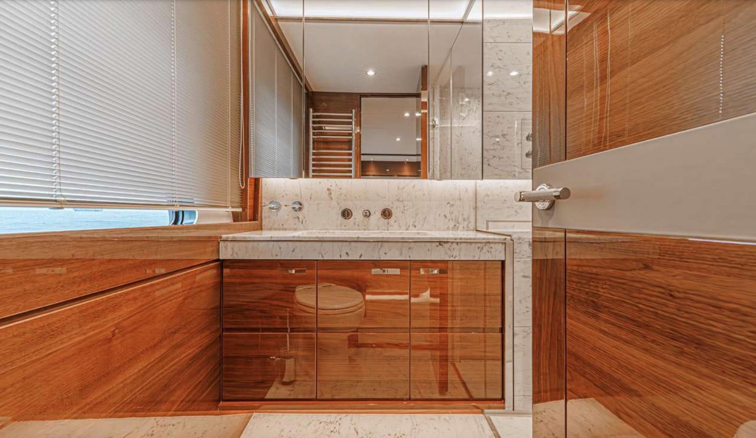 a kitchen with a large mirror aboard PRINCESS 35M AVALON Yacht for Sale