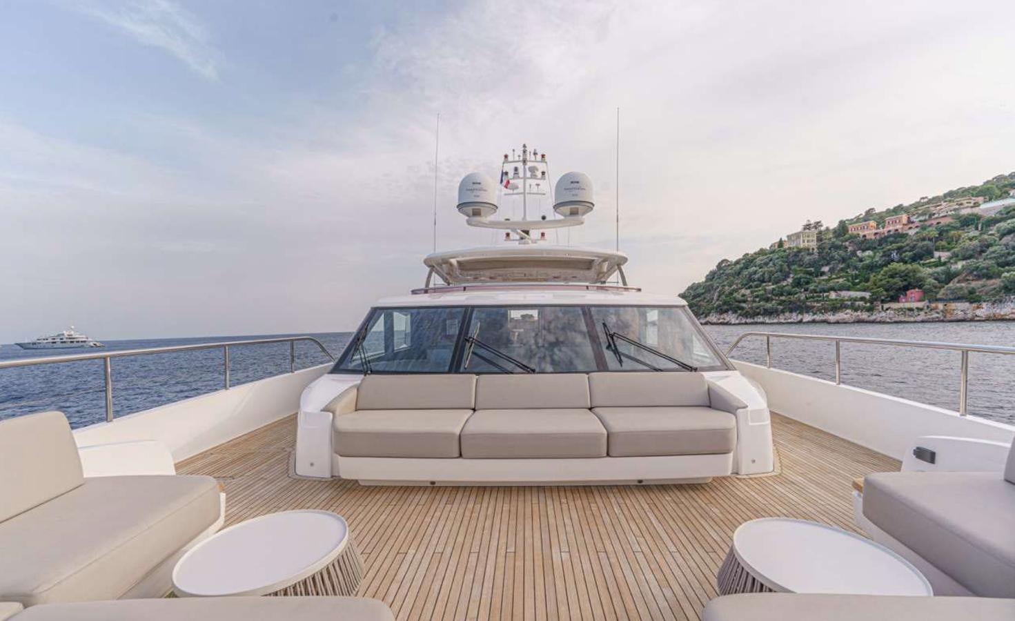 a white car on a deck aboard PRINCESS 35M AVALON Yacht for Sale