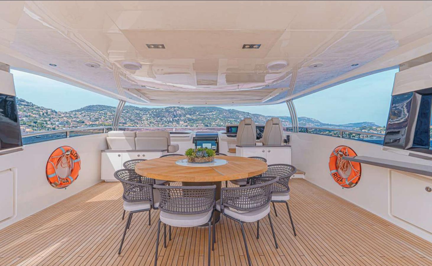 a room with a table chairs and a large window aboard PRINCESS 35M AVALON Yacht for Sale
