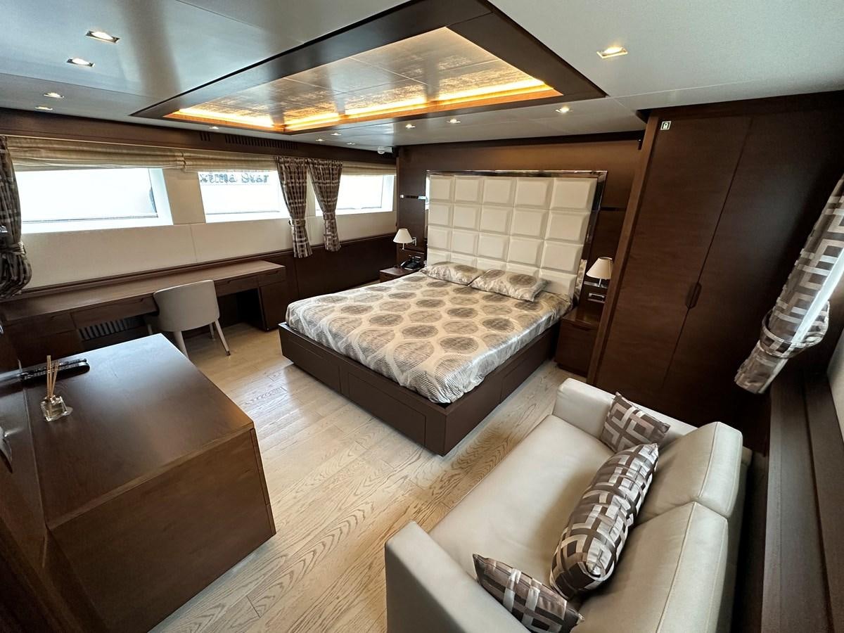 a room with a couch and a table aboard AZIMUT GRANDE 116 Yacht for Sale