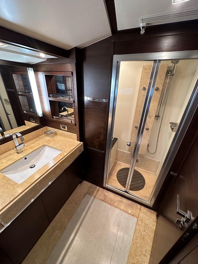 a bathroom with a glass shower aboard AZIMUT GRANDE 116 Yacht for Sale