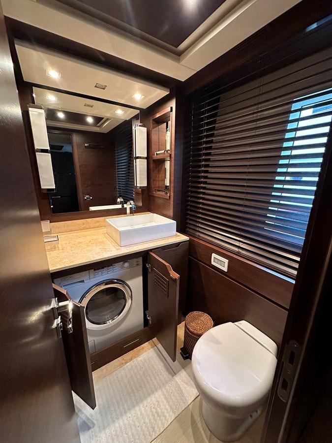 a bathroom with a washer and dryer aboard AZIMUT GRANDE 116 Yacht for Sale