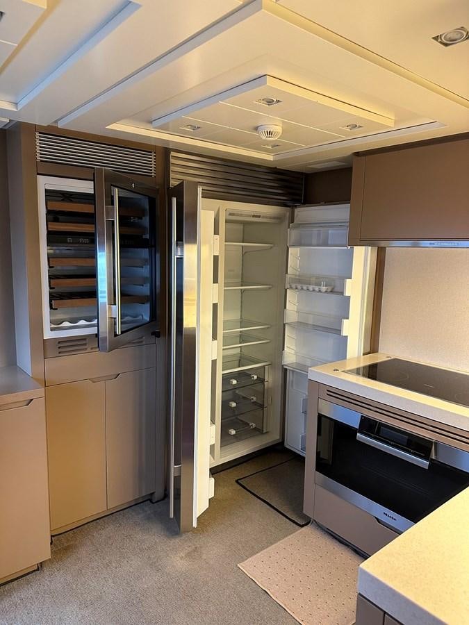 a room with a large glass shelving unit and a large shelving unit aboard AZIMUT GRANDE 116 Yacht for Sale