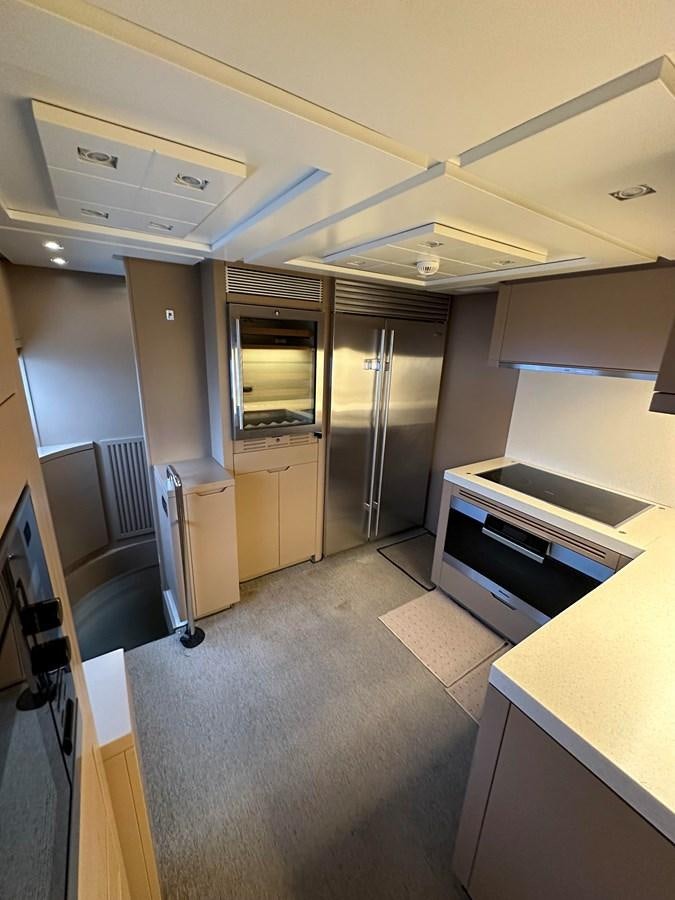 a kitchen with a large counter aboard AZIMUT GRANDE 116 Yacht for Sale