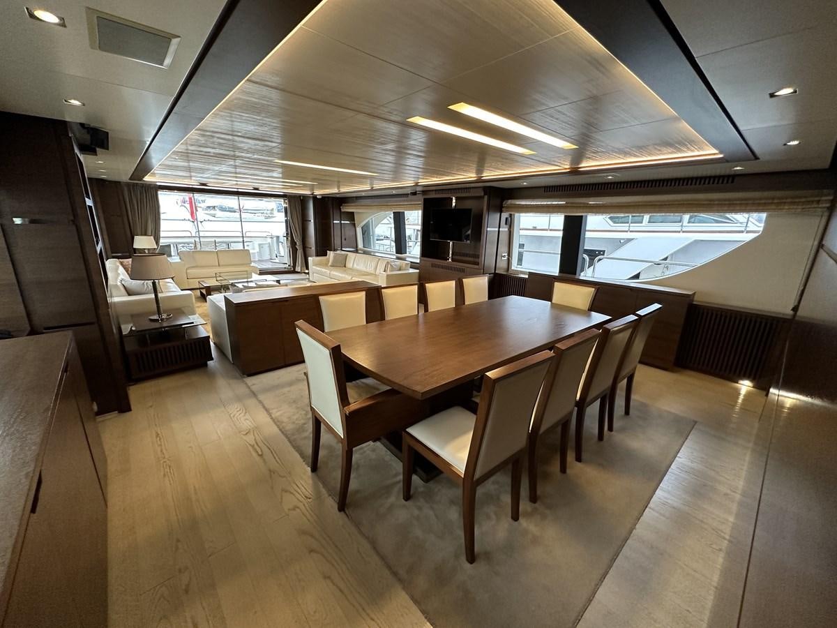 a large room with tables and chairs aboard AZIMUT GRANDE 116 Yacht for Sale