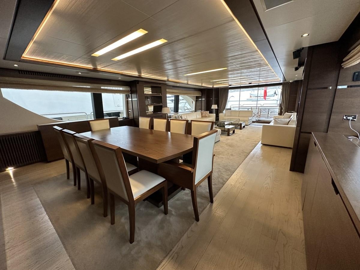 a large room with tables and chairs aboard AZIMUT GRANDE 116 Yacht for Sale