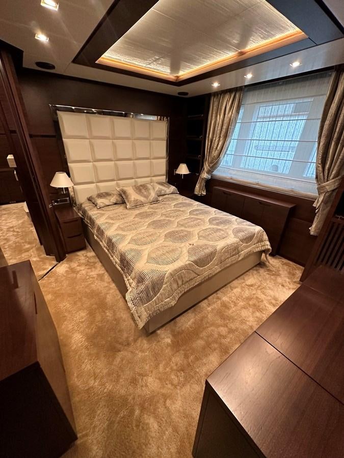 a bedroom with a large bed aboard AZIMUT GRANDE 116 Yacht for Sale