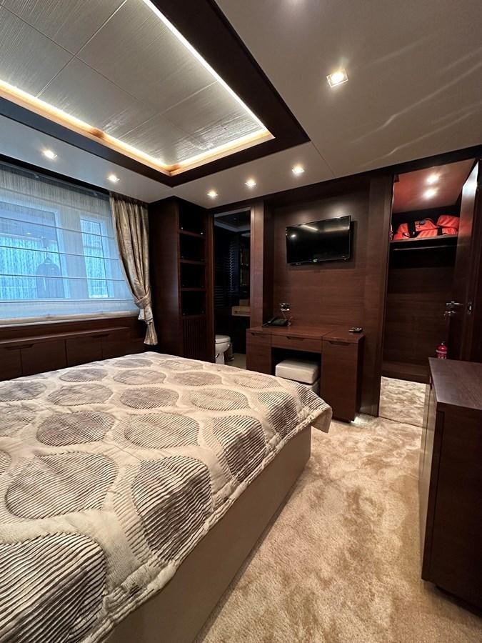 a bedroom with a large bed aboard AZIMUT GRANDE 116 Yacht for Sale