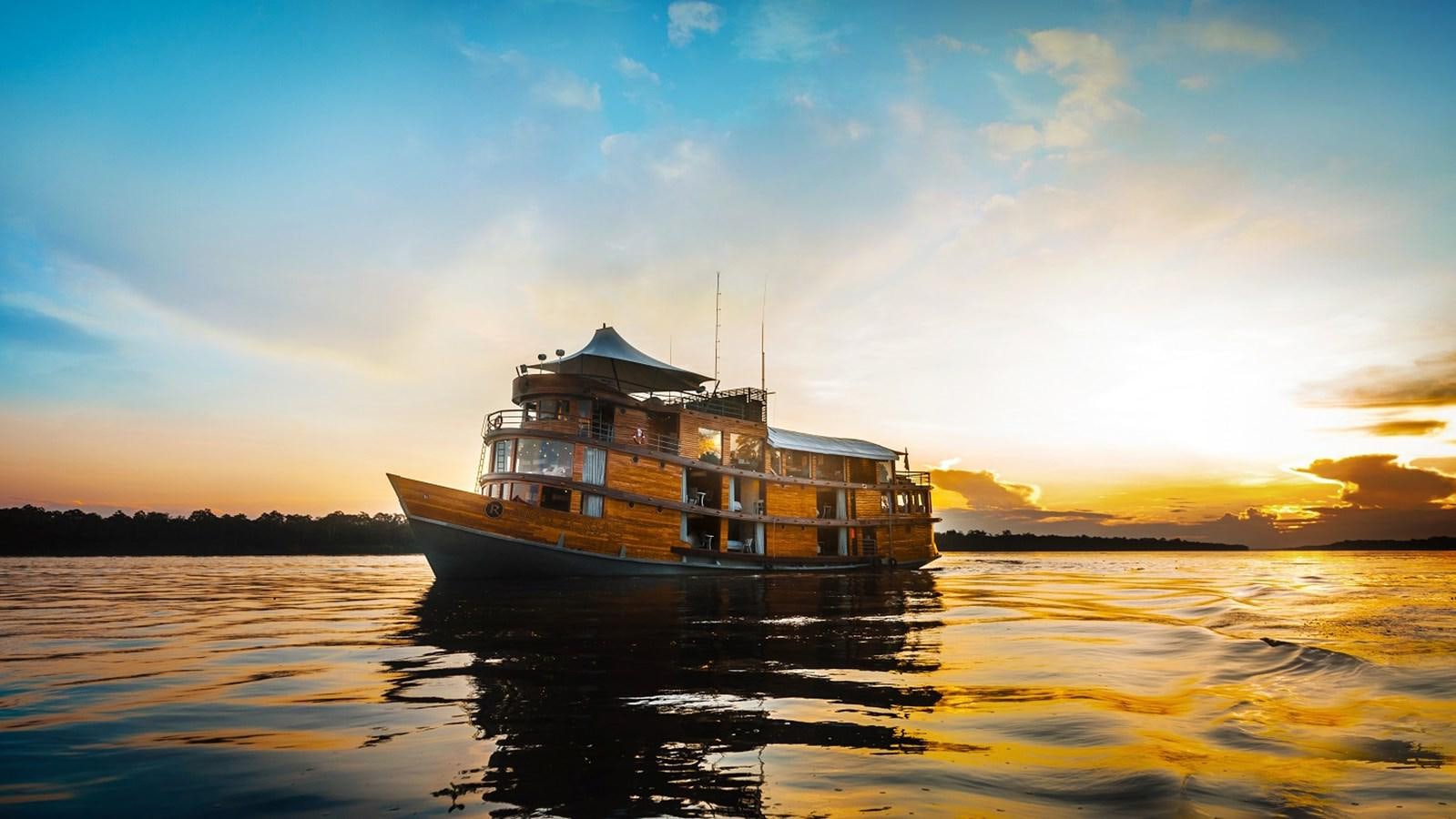 a boat on the water aboard CRUCERO AMAZONAS Yacht for Sale