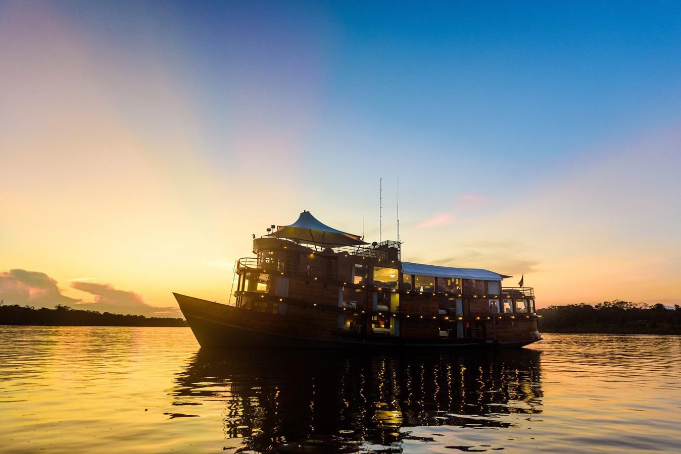 a boat on the water aboard CRUCERO AMAZONAS Yacht for Sale