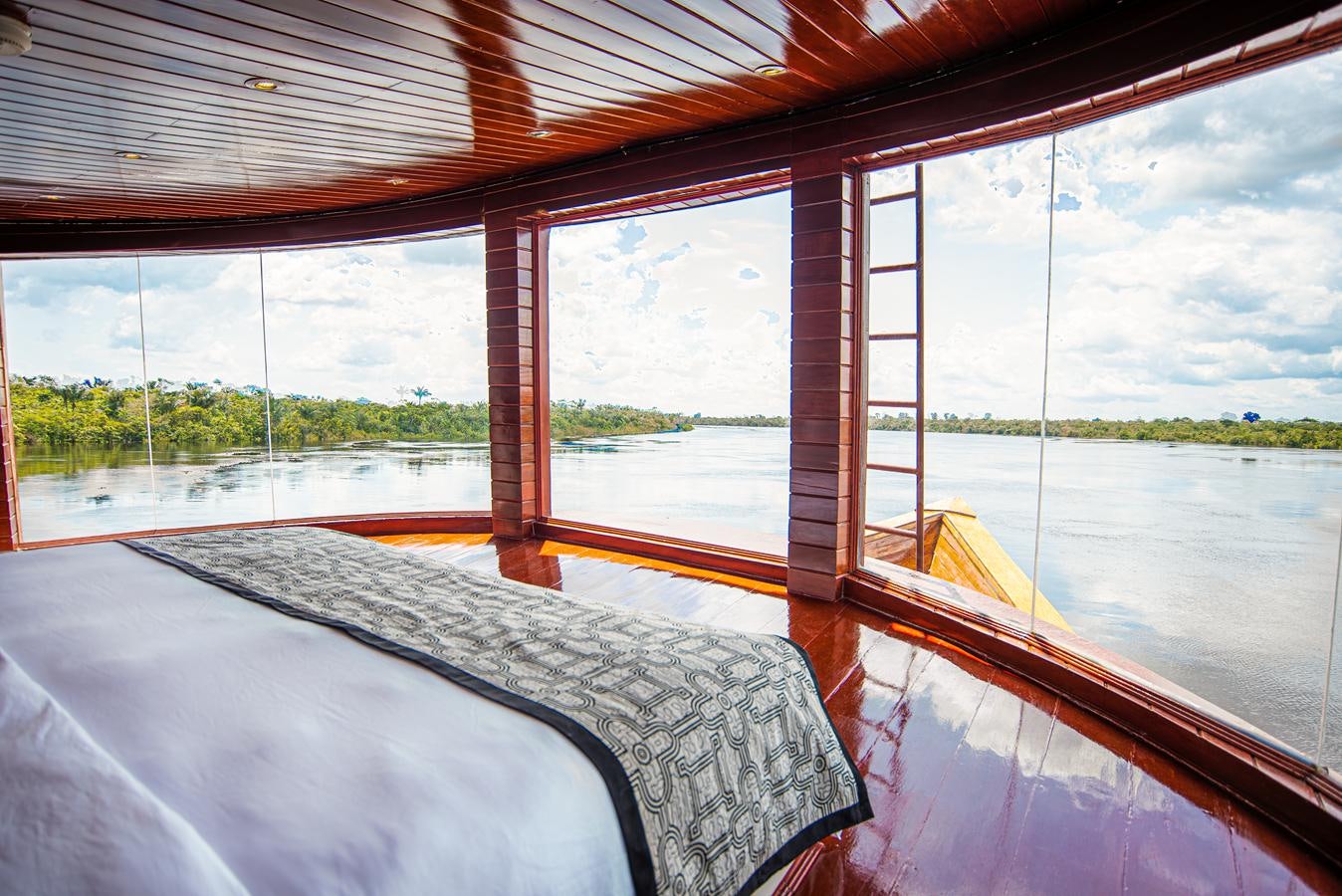a boat on the water aboard CRUCERO AMAZONAS Yacht for Sale