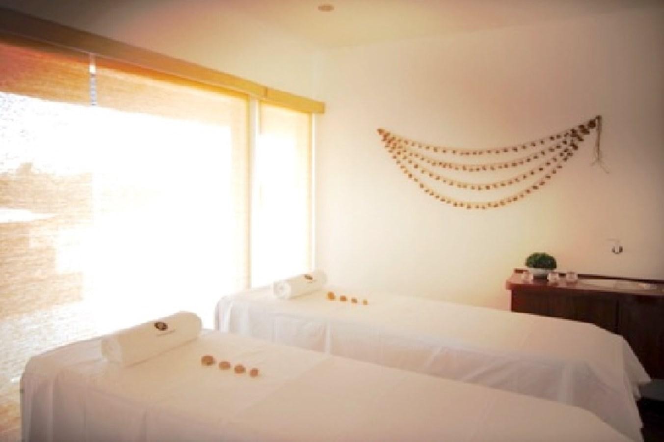 a bed with a white sheet and a white pillow aboard CRUCERO AMAZONAS Yacht for Sale