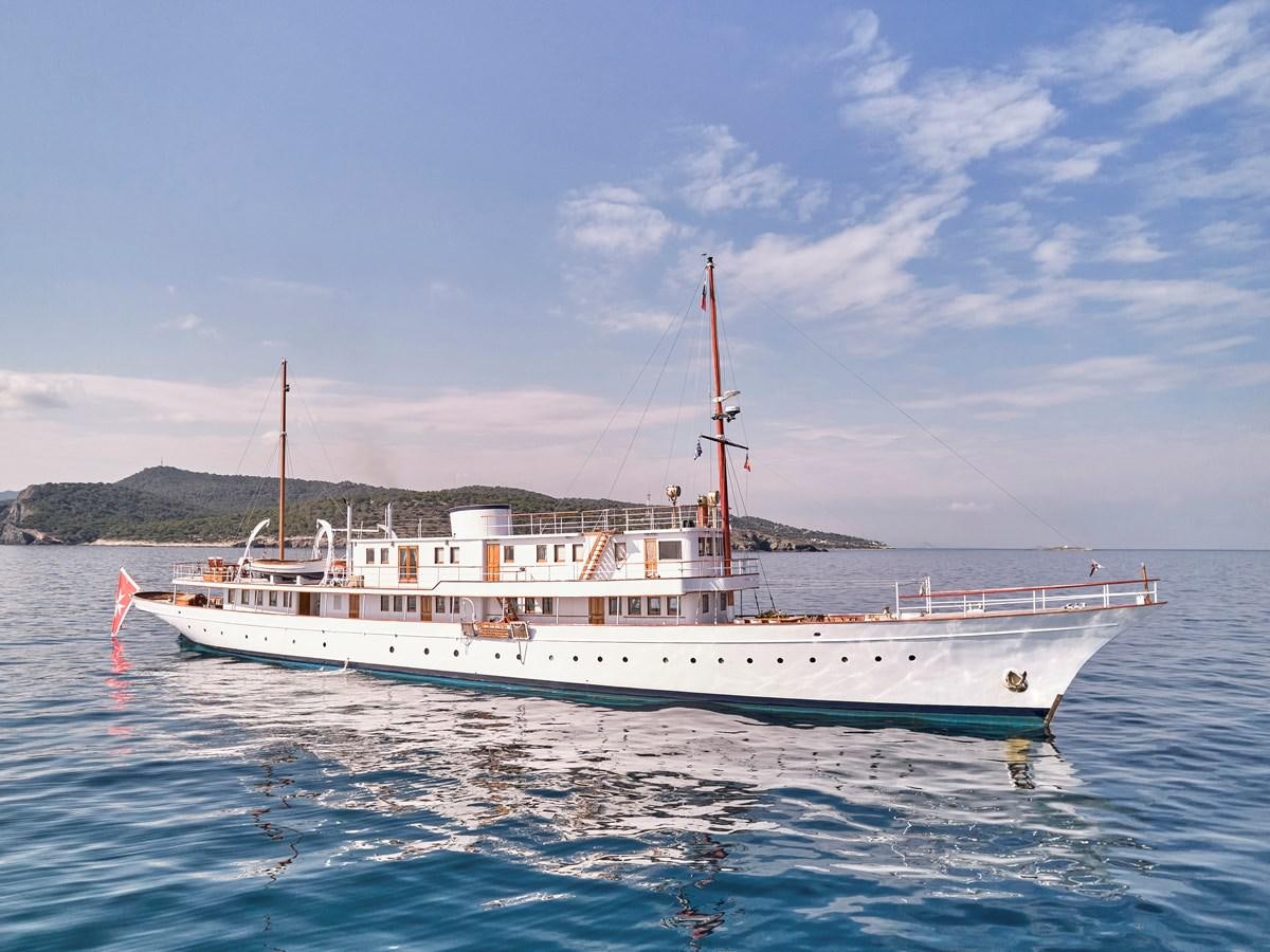 a large white boat in the water aboard MADIZ Yacht for Sale