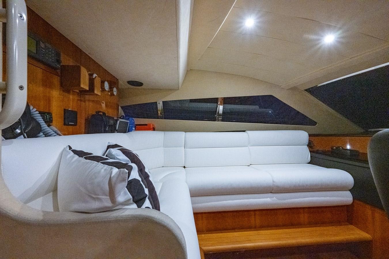 a room with a couch and a bed aboard EVERYTHING GOOD Yacht for Sale