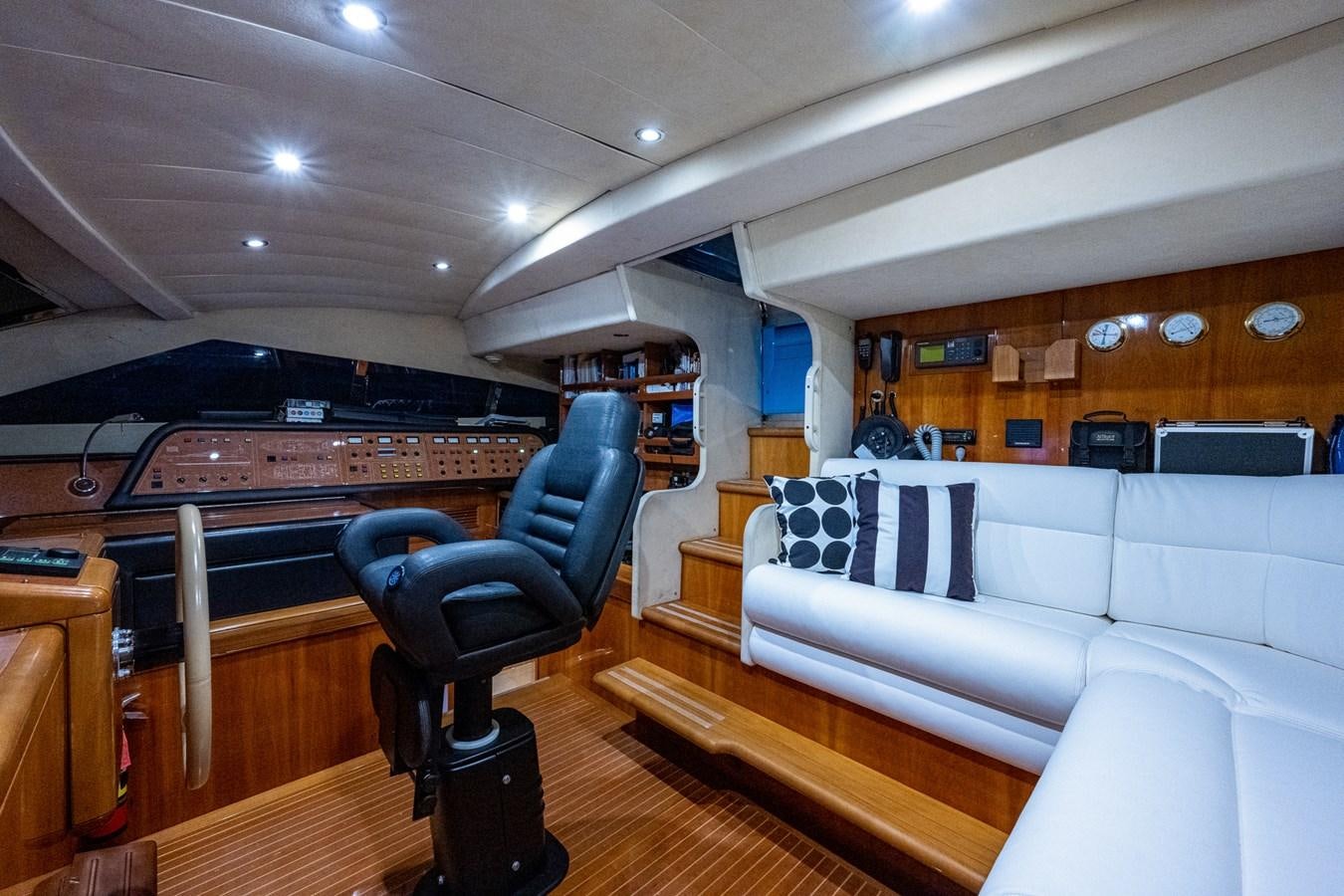 a room with a piano and a couch aboard EVERYTHING GOOD Yacht for Sale