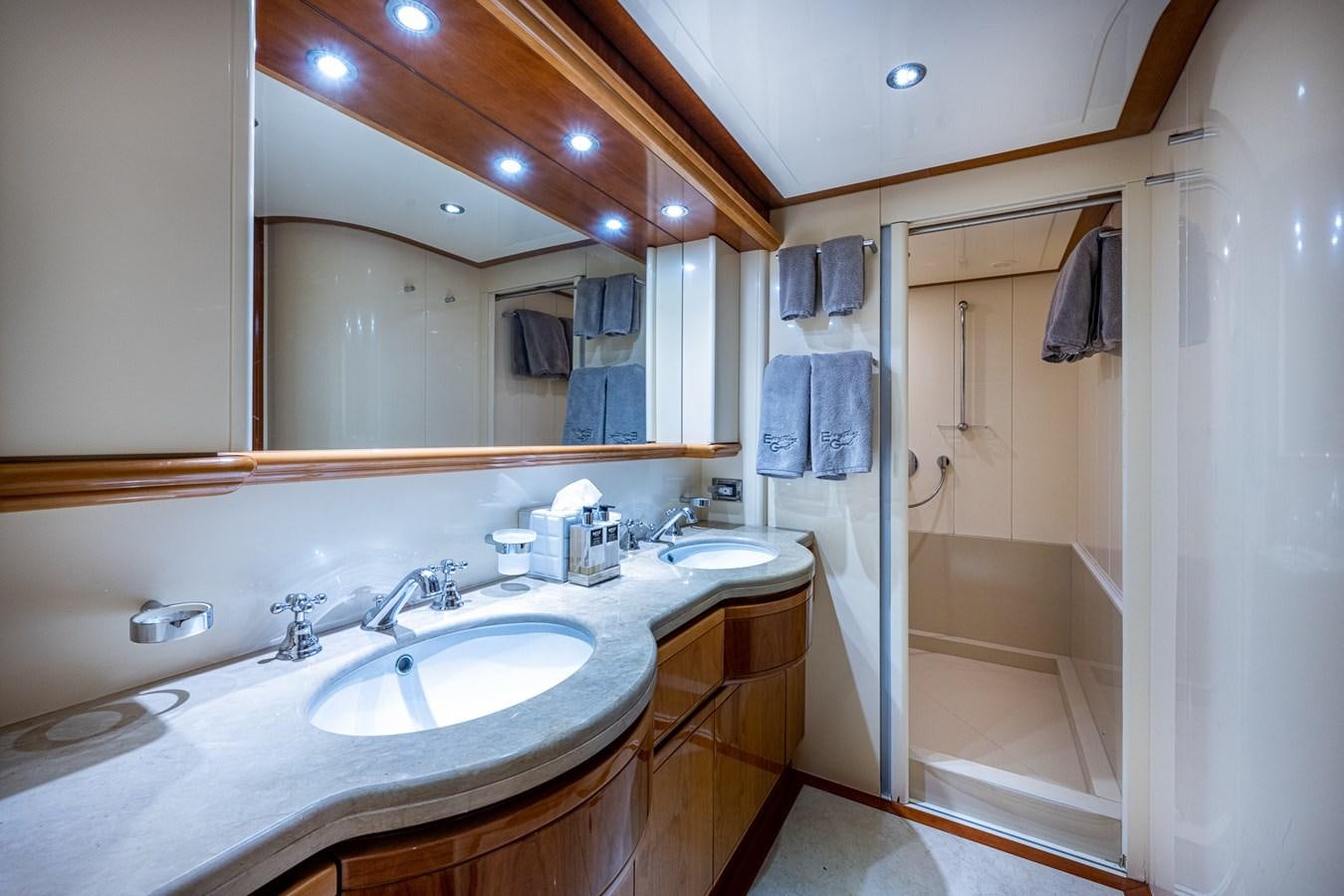 a bathroom with a large mirror aboard EVERYTHING GOOD Yacht for Sale