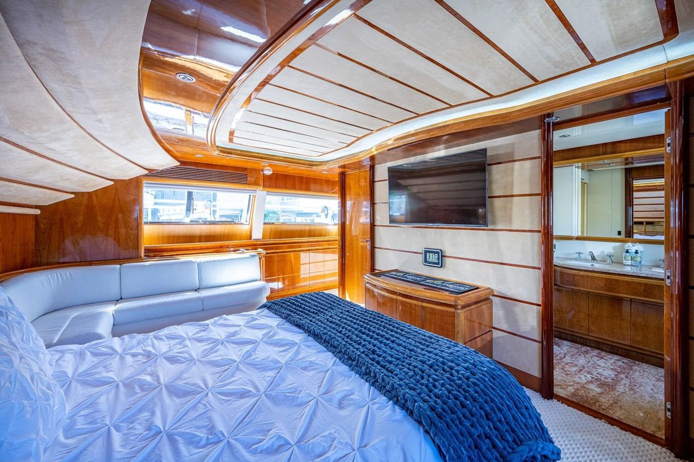 a room with a bed and a wood door aboard EVERYTHING GOOD Yacht for Sale