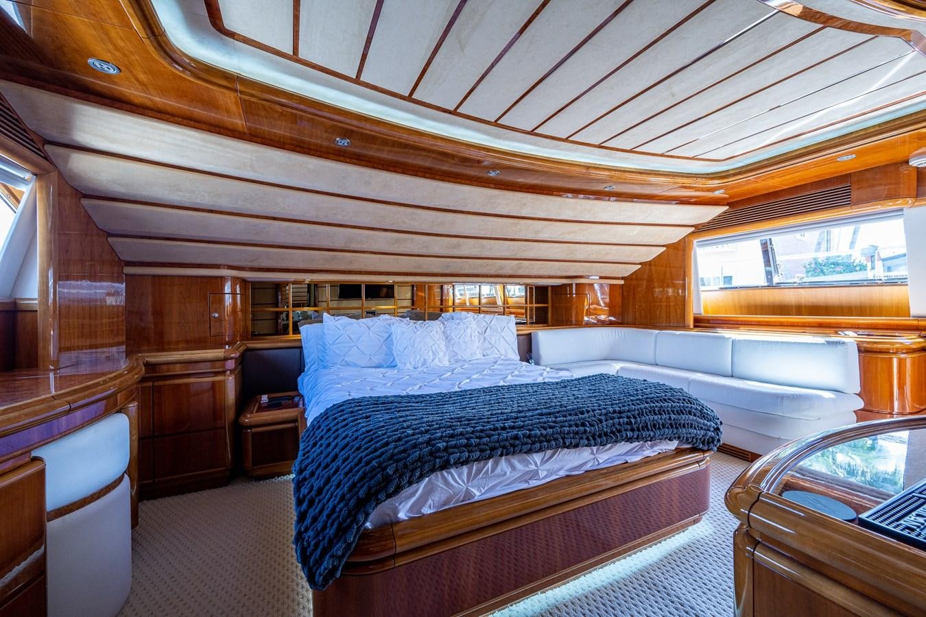 a room with a bed and a couch aboard EVERYTHING GOOD Yacht for Sale