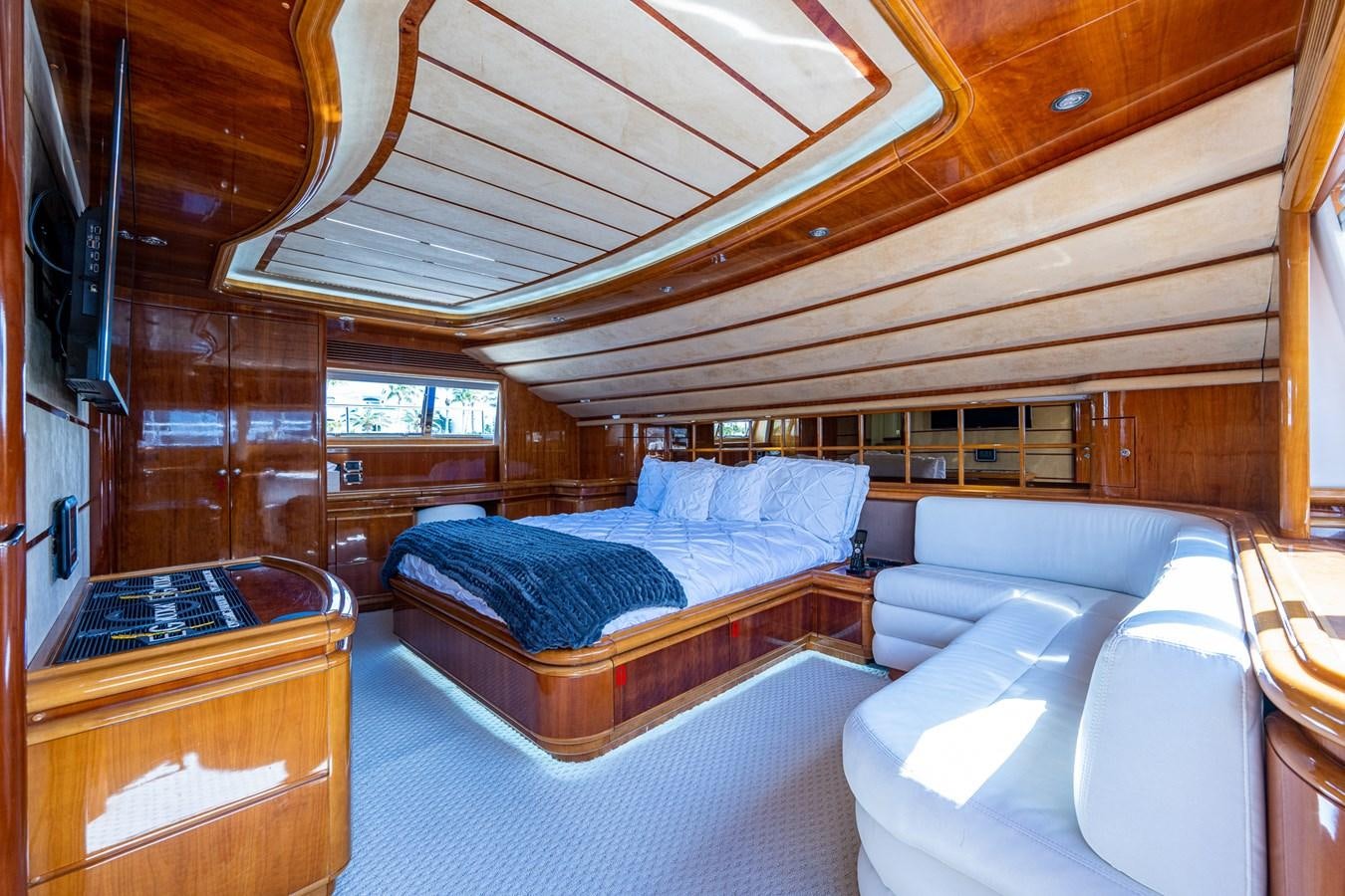 a room with a bed and a couch aboard EVERYTHING GOOD Yacht for Sale