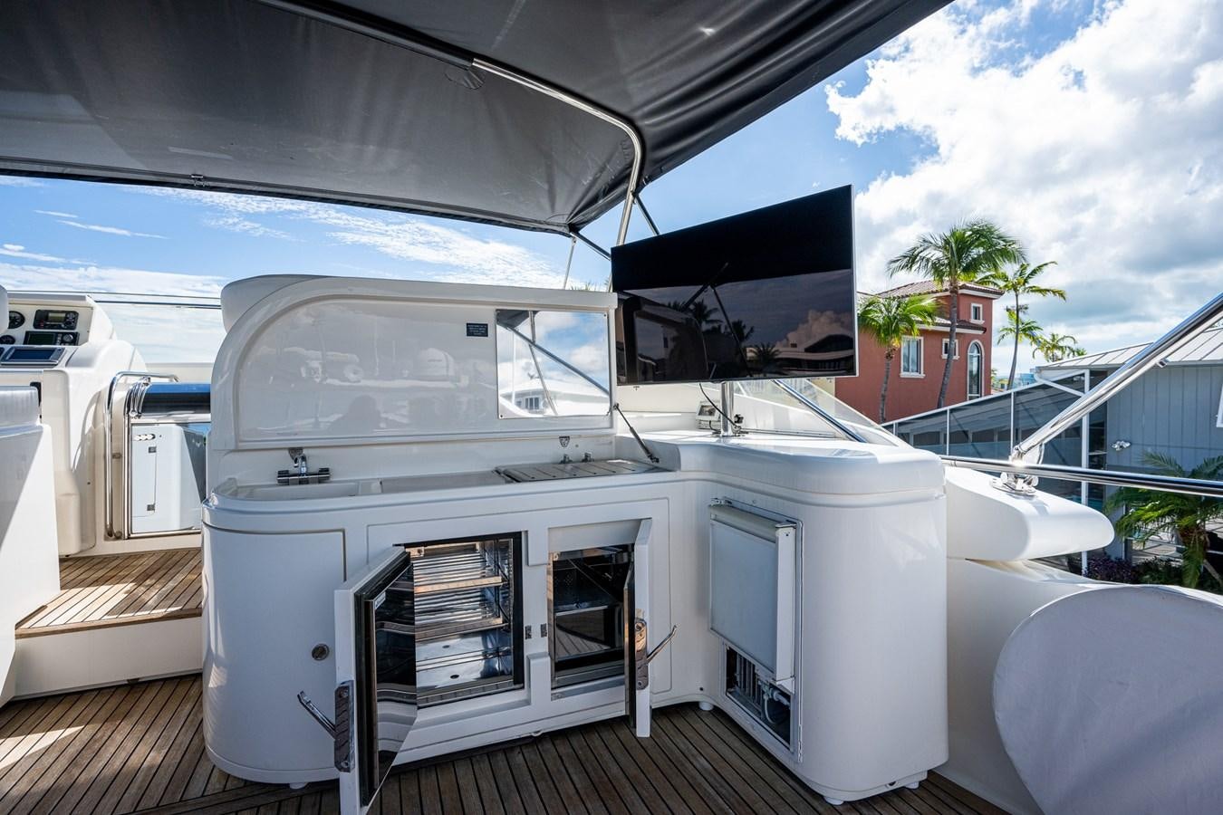 a white boat on a deck aboard EVERYTHING GOOD Yacht for Sale