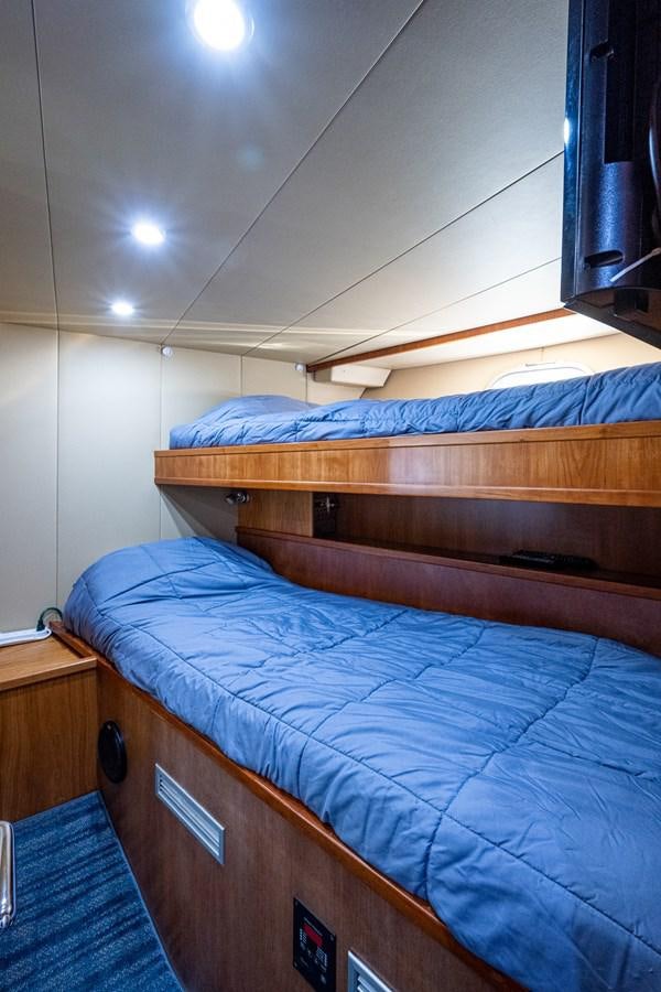 a couple of beds in a room aboard EVERYTHING GOOD Yacht for Sale