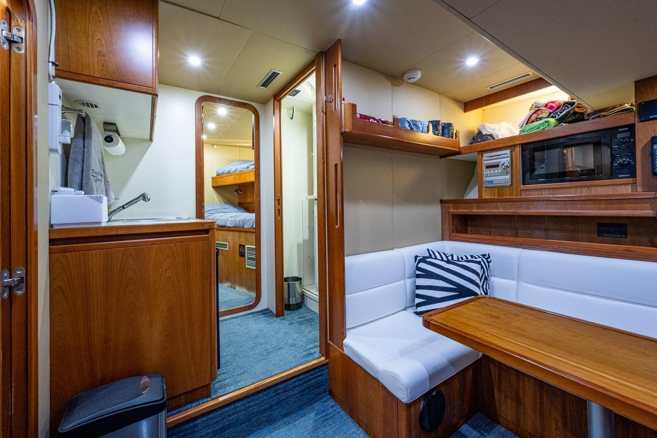 a room with a bed and a desk aboard EVERYTHING GOOD Yacht for Sale