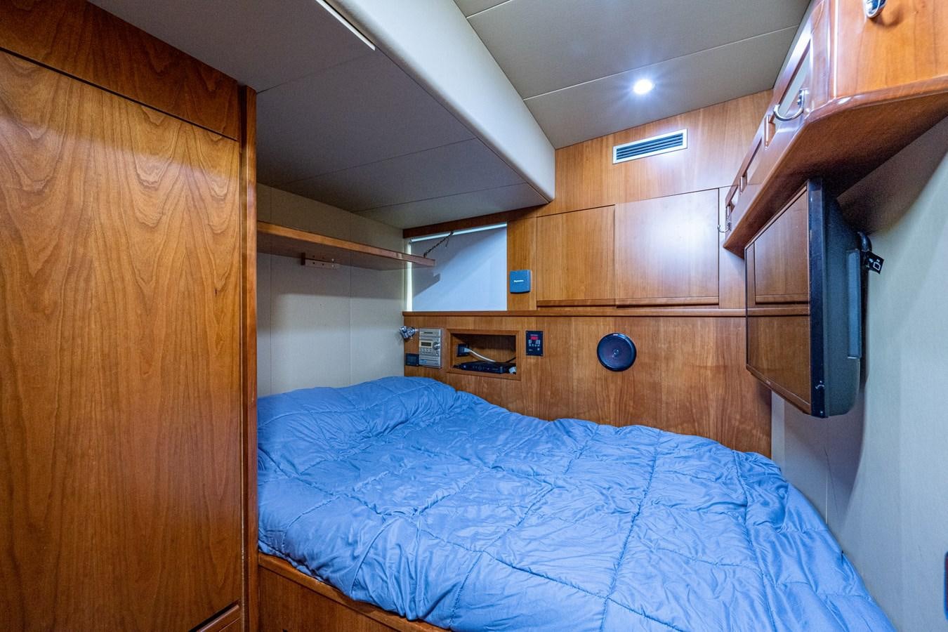 a bed in a room aboard EVERYTHING GOOD Yacht for Sale