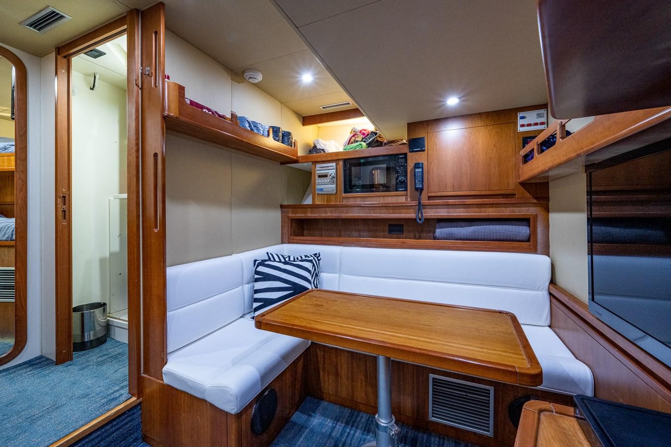 a room with a table and chairs aboard EVERYTHING GOOD Yacht for Sale