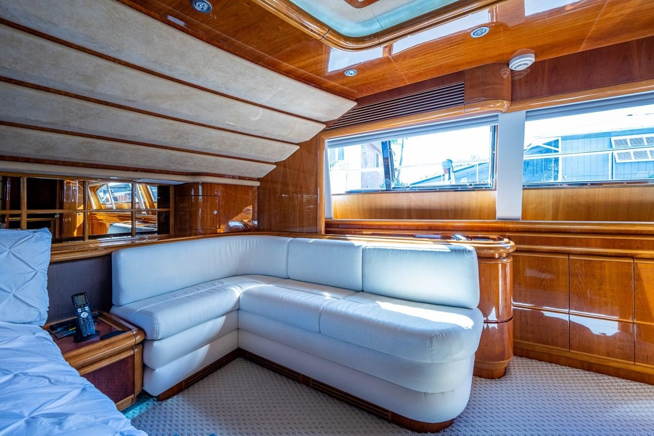 a room with a bed and a window aboard EVERYTHING GOOD Yacht for Sale
