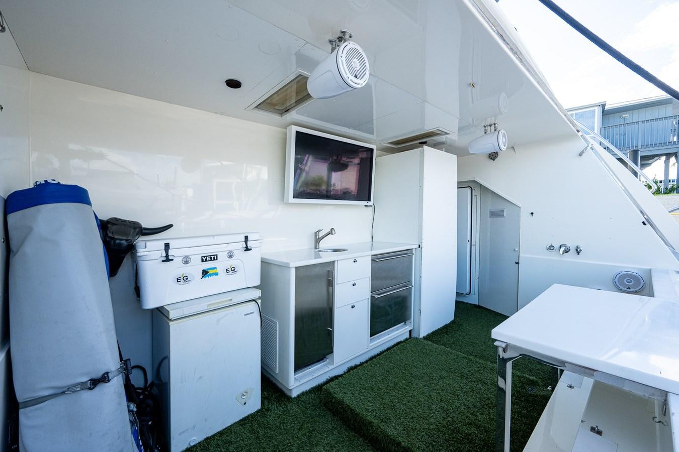 a room with a table and a microwave oven aboard EVERYTHING GOOD Yacht for Sale