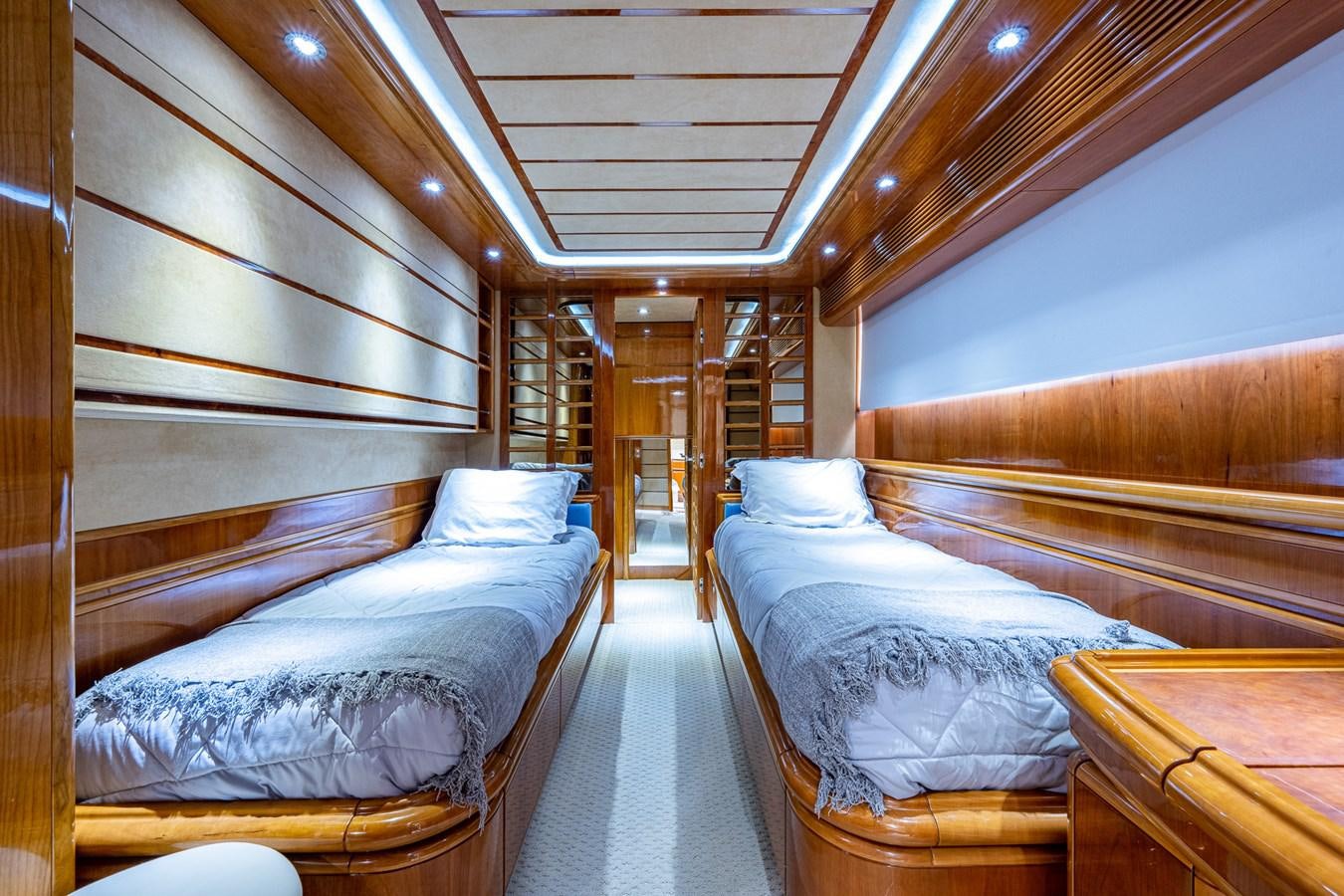 a room with beds and a wood door aboard EVERYTHING GOOD Yacht for Sale