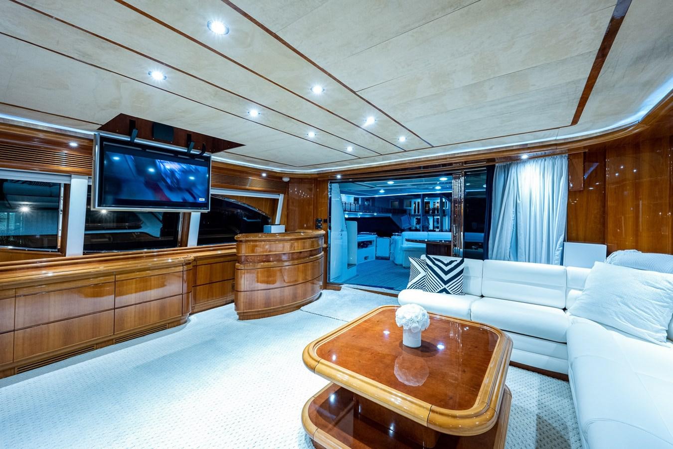 a living room with a large television aboard EVERYTHING GOOD Yacht for Sale